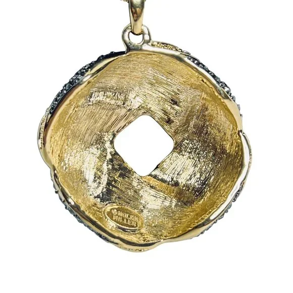 Nolan Miller Gold Tone Rope Chain Necklace With Love Knot Crystal Pendant (6006) - Picture 3 of 6